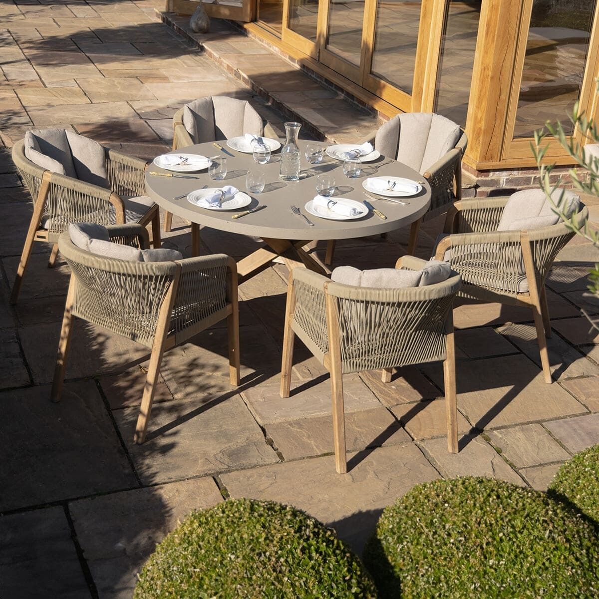 Martinique 6 Seat Round Dining Set with 150cm Concrete Table Top. GardenBox Price £1749