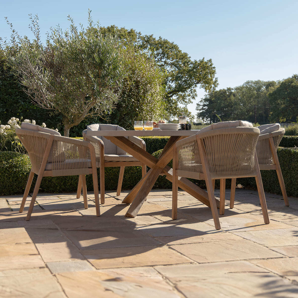 Martinique 4 Seat Round Dining Set with 135cm Concrete Table Top. GardenBox Price £1449