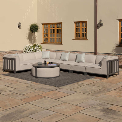 IBIZA Large Corner Sofa Set with round coffee table with 3 foot stools by Maze Rattan. GardenBox Price £4549